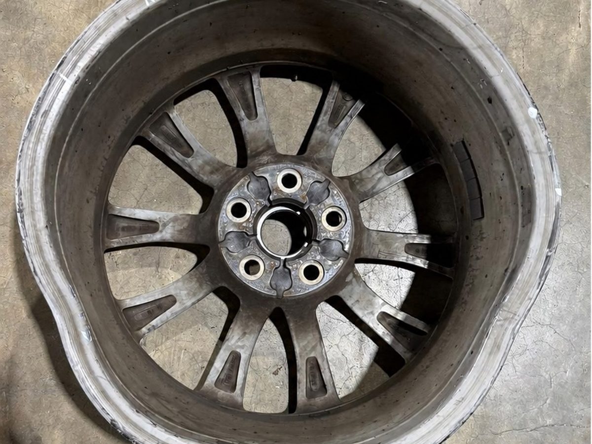 Bent and damaged alloy wheel rim showing wear before repair in North Little Rock Arkansas